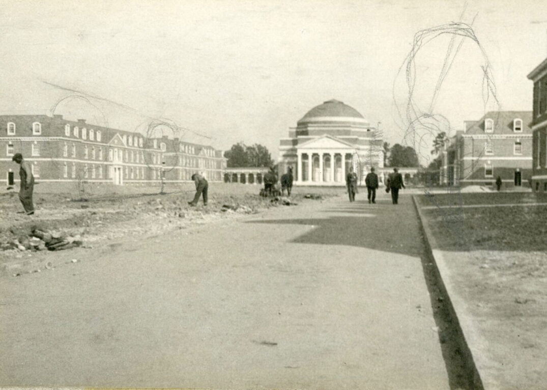 Monochrome photograph showing Duke's East Campus under construction: A domed auditorium in the background with workers standing or walking in the foreground and trees sketched in pencil along the avenue leading to the auditorium.