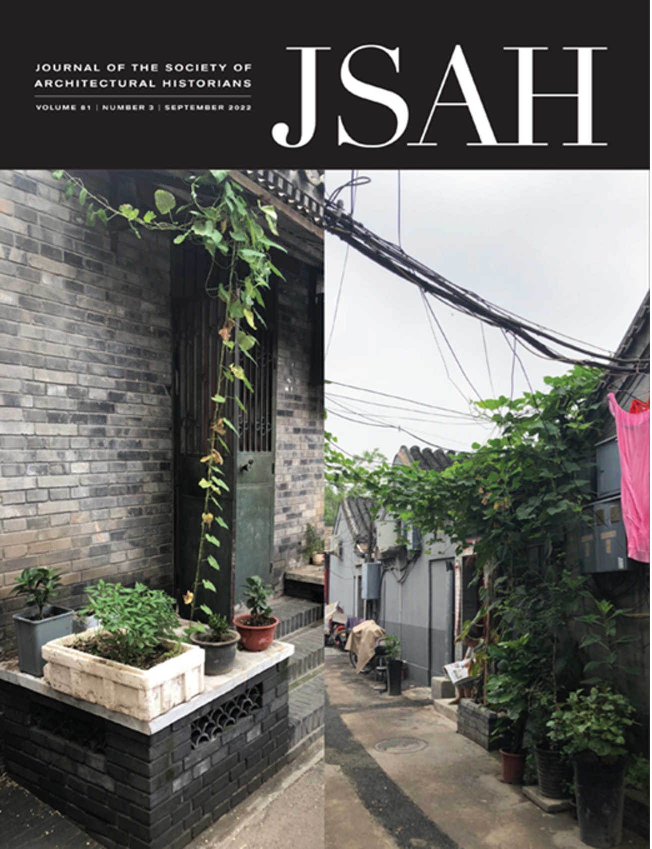 Cover for Journal of the Society of Architectural Historians (JSAH) Volume 81 | Number 3 | September 2022, written in white text on a black background at the top of the cover. Below is a color photograph of an alley with plants growing in pots and on sides of buildings and power lines crisscrossing the alley.